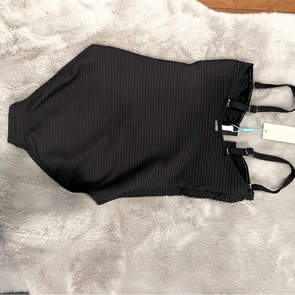 size 6 Brand new with Tags One piece U-Bar one piece swim suit.